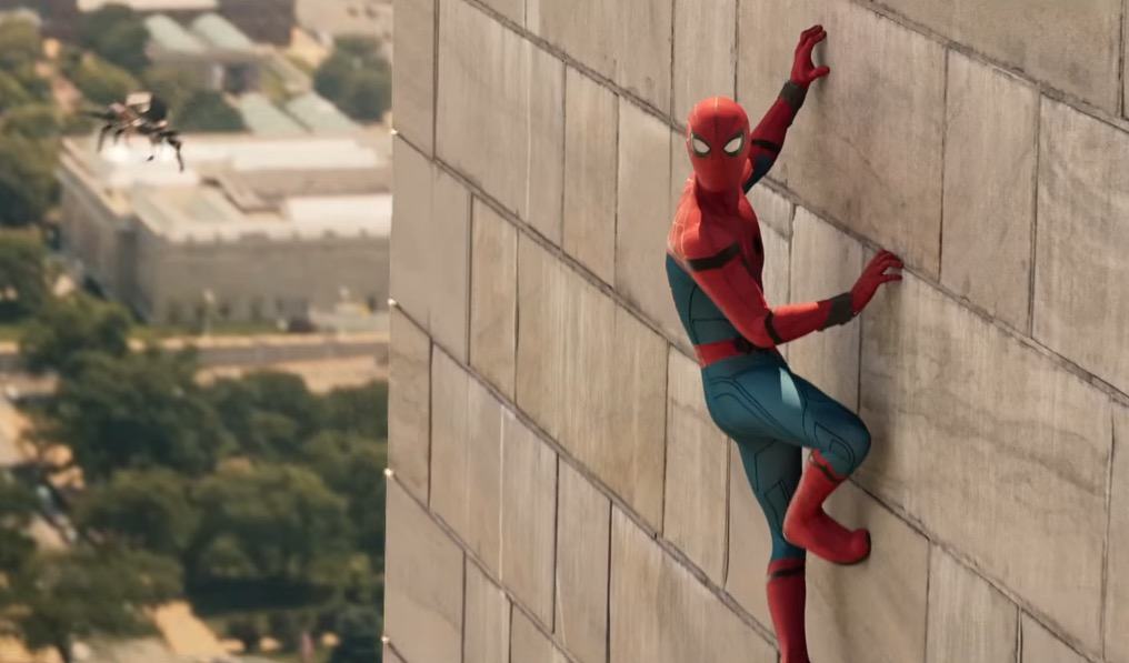 Spider-Man hangs off a wall while flying a new spider drone