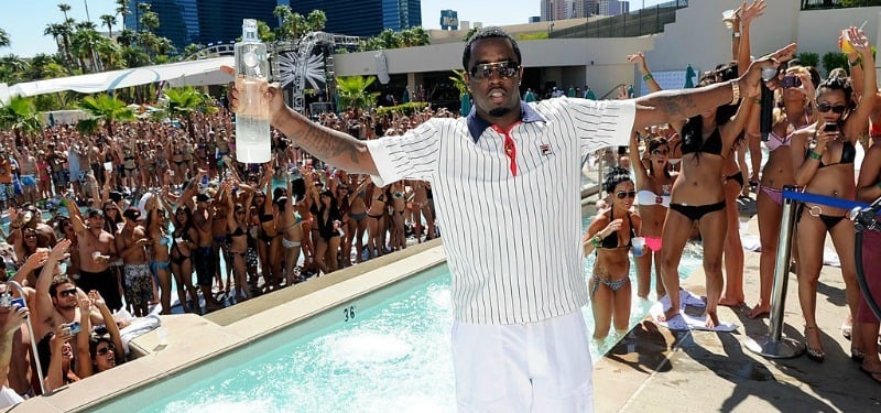 Sean Combs holding a bottle of Ciroc at a pool party
