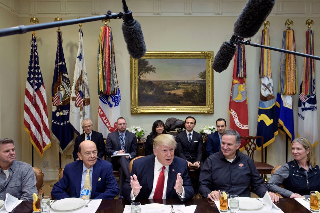 President Donald Trump speaks at a meeting.