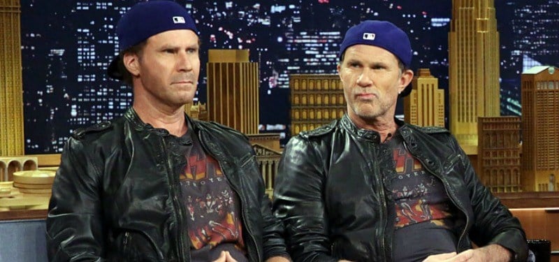 Will Ferrell and Chad Smith are dressed in the same hats, shirts, and leather jacket together