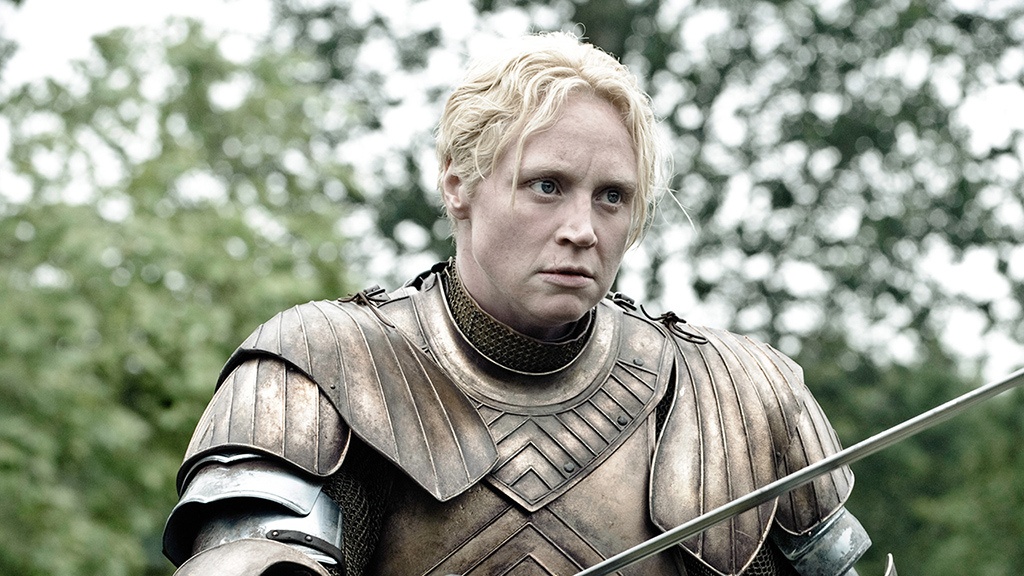 Brienne of Tarth, in her armor, brandishes her sword in a scene from 'Game of Thrones.'