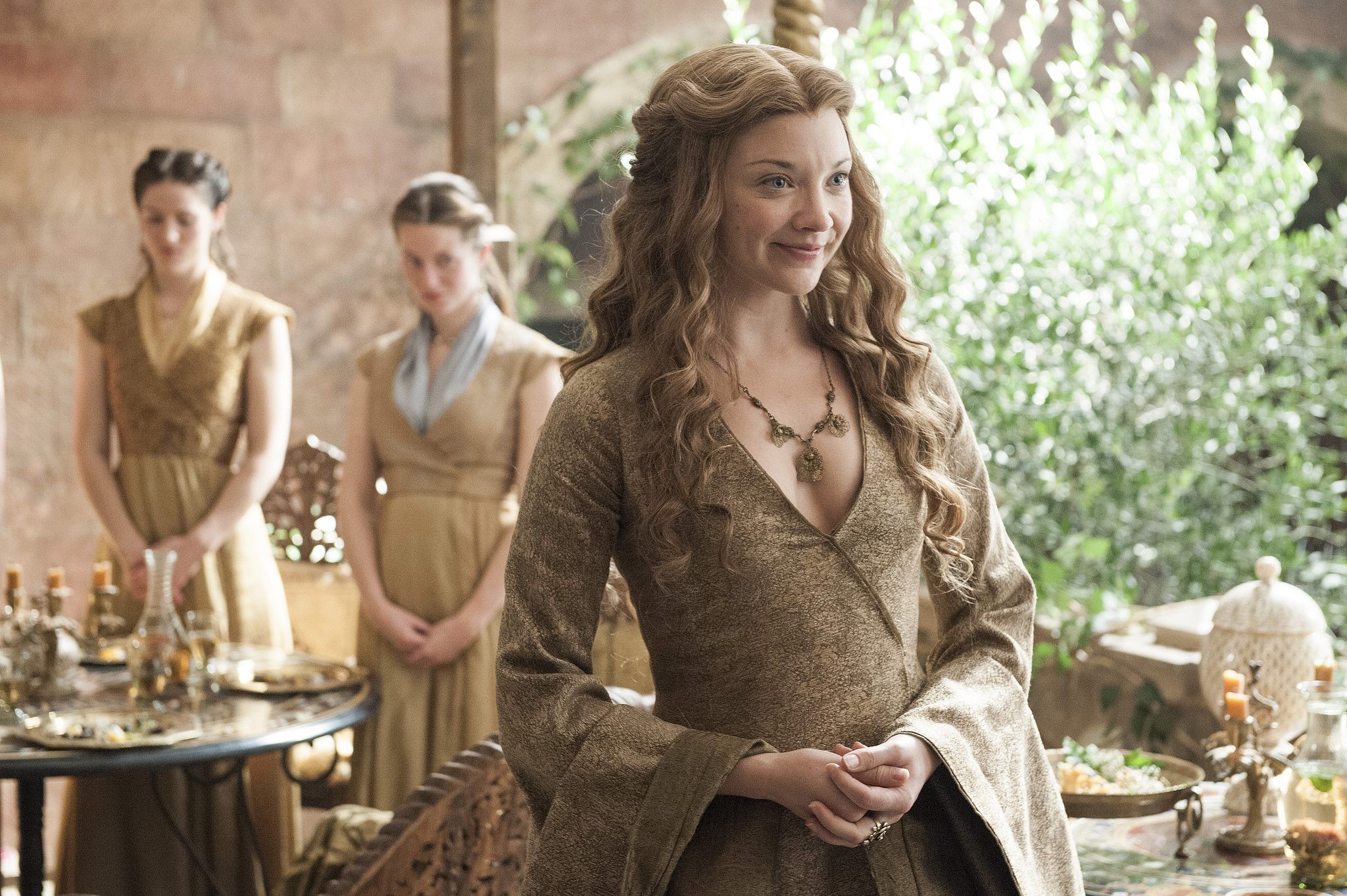 Maegary Tyrell smiles brightly in a scene from 'Game of Thrones.'