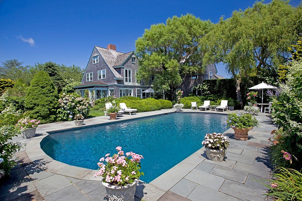 The 'Grey Gardens' estate, currently owned by journalist Sally Quinn, has a pool and lush gardens. 