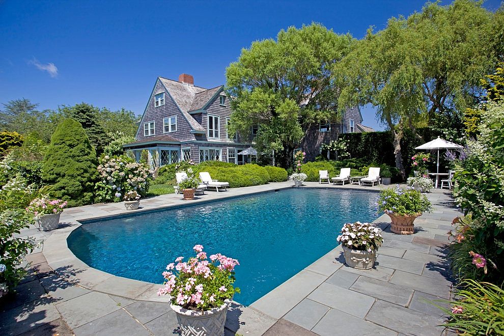 The 'Grey Gardens' estate, currently owned by journalist Sally Quinn, has a pool and lush gardens.