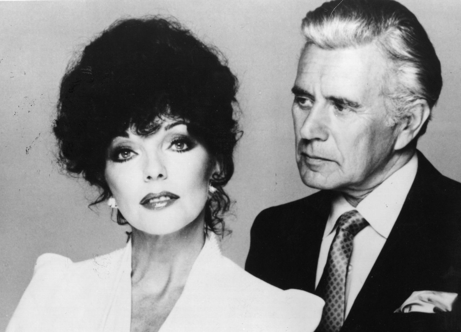 Alexis (Joan Collins) and Blake (John Forsythe) in a promotional image from 'Dynasty'