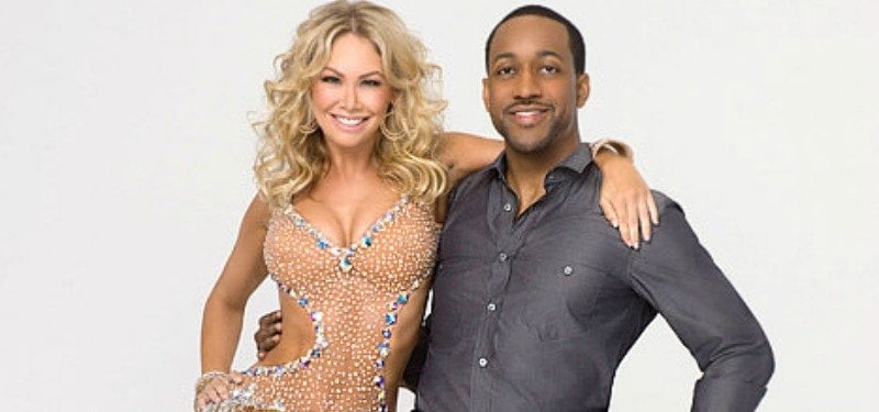 Kym Johnson and Jaleel White are posing together with their arms around each other.