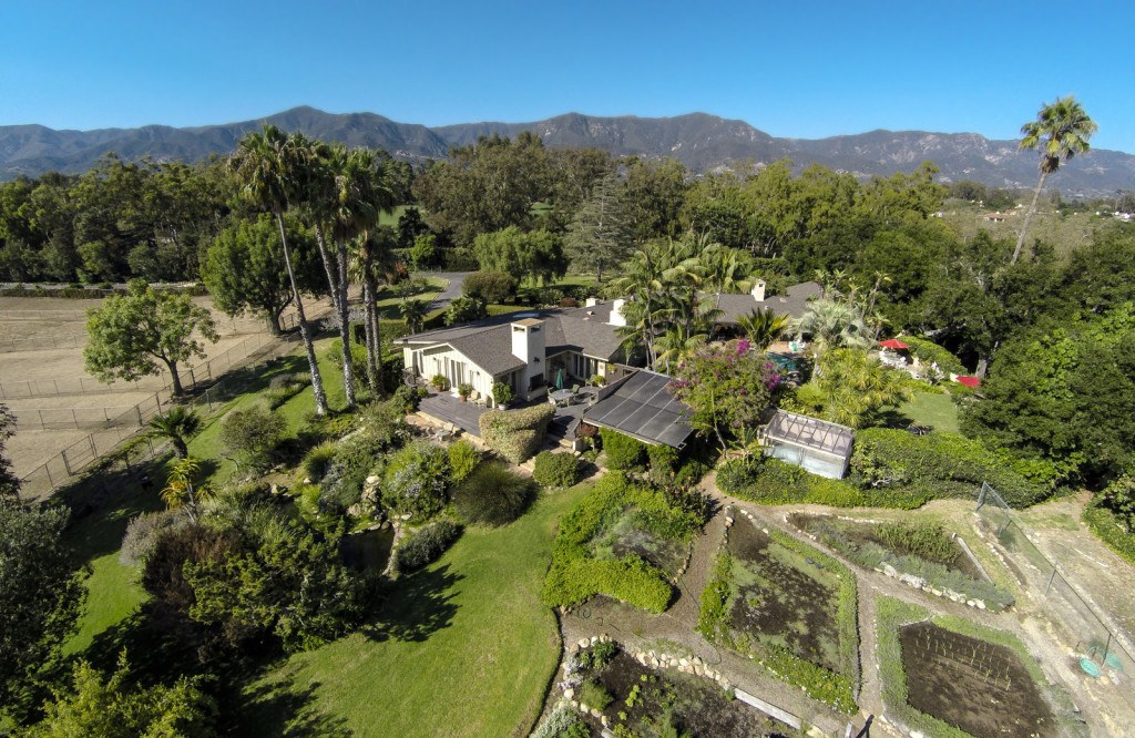 An aerial view of Oprah's Montecito, California estate shows a sprawling mansion and large property.