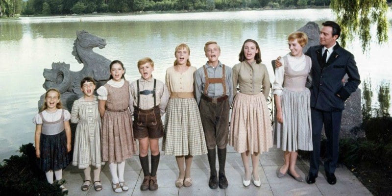 The cast of The Sound of Music lined up signing. 