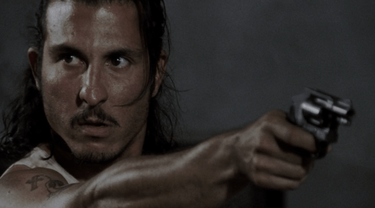 Tomas aims his gun in the prison in a scene from Season 3 of 'The Walking Dead'