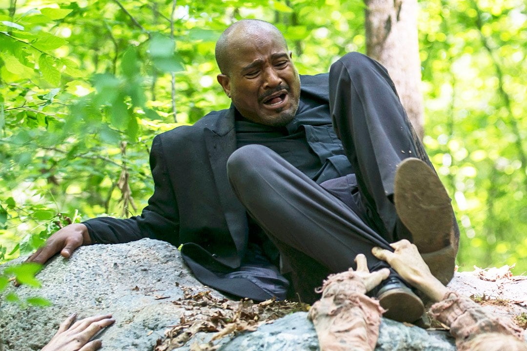 Gabriel attempts to get away from walkers in a scene from 'The Walking Dead'