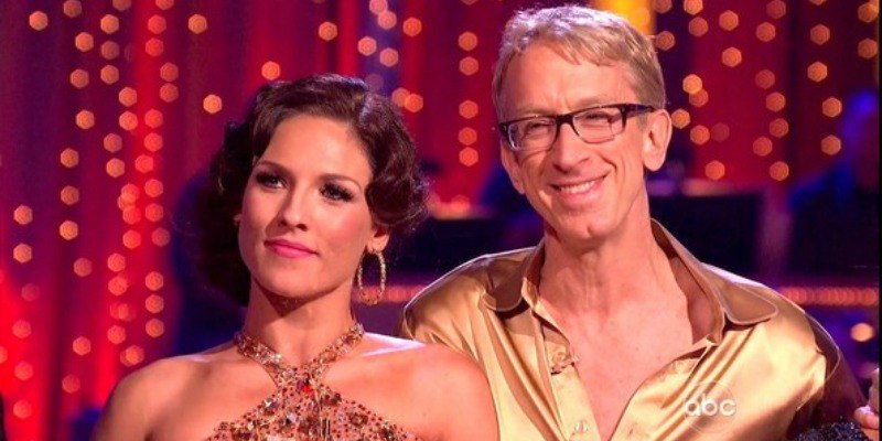 Andy Dick is smailing with his dance partner on Dancing With the Stars.