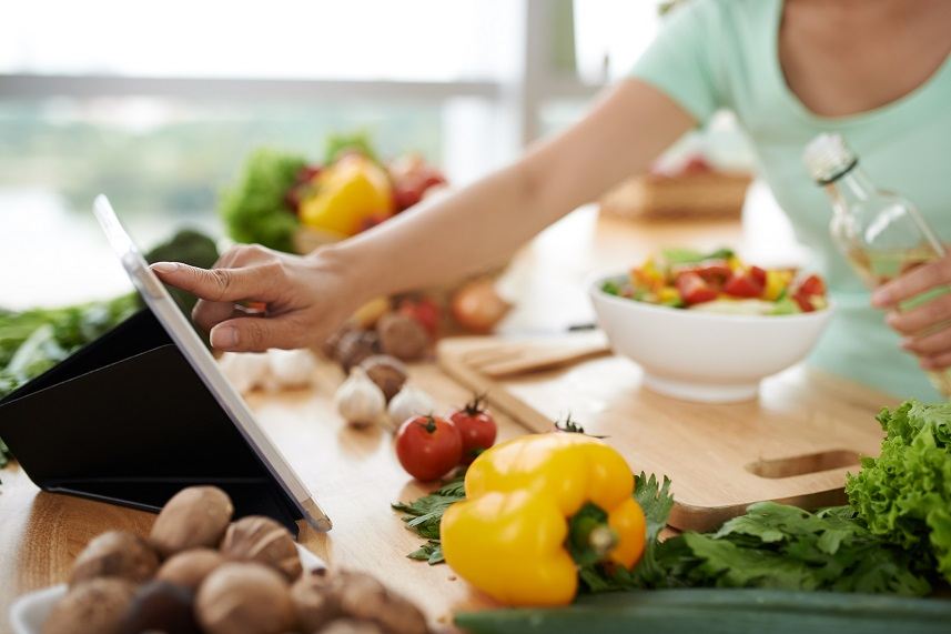 Woman checking recipe