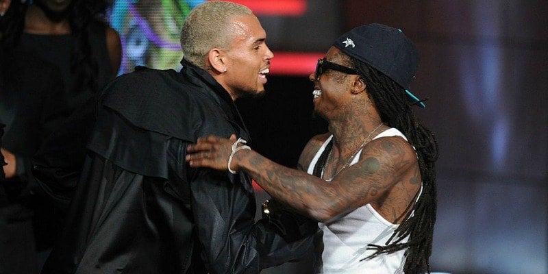 Chris Brown and Lil Wayne are shaking hands on stage at the BET Awards.