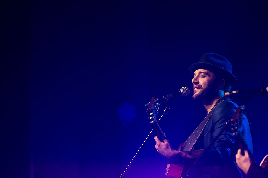 Mark Ballas sings with guitar