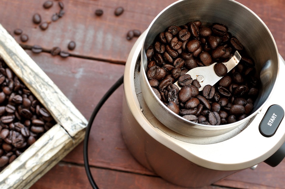 Electric coffee grinder with roasted coffee beans