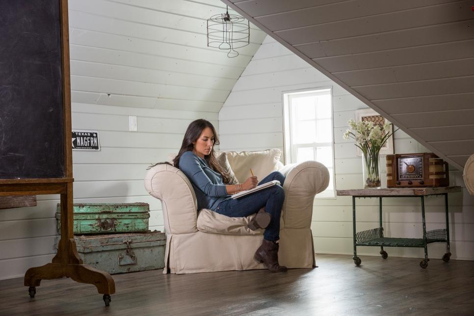 Joanna Gaines, co-host of HGTV's Fixer Upper, relaxes in a comfortable chair as she plans a renovation for a lucky family.