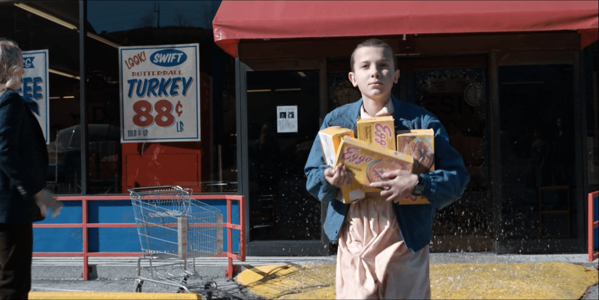 On 'Stranger Things,' Eleven (Millie Bobby Brown) steals waffles from the grocery store