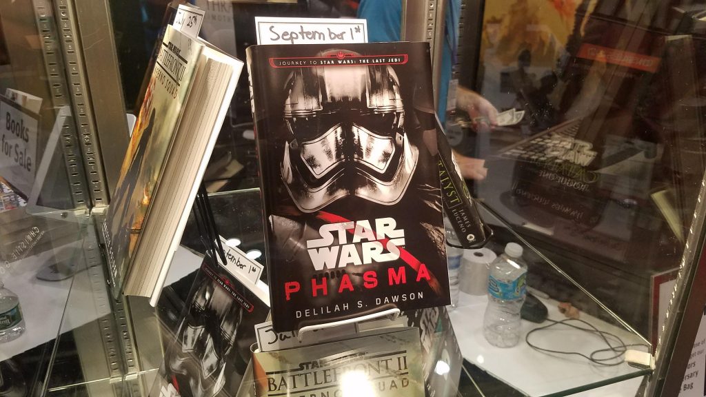 Captain Phasma's book in a glass case, with her chrome helmet pictured