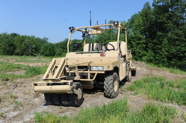 A Raider I Engineer sits in a grassy field.