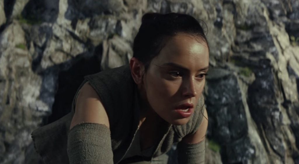 Rey bent over, sweaty and panting