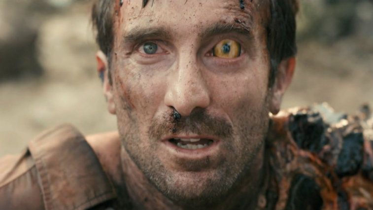 Sharlto Copley with one crazy alien yellow eye in District 9