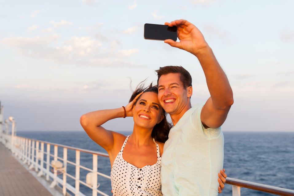 Couple taking photo of themselves on cruise