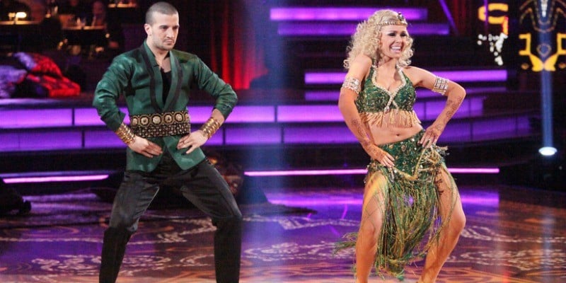 Katherine Jenkins and Mark Ballas stand side by side and have their hands on their hips while dancing.