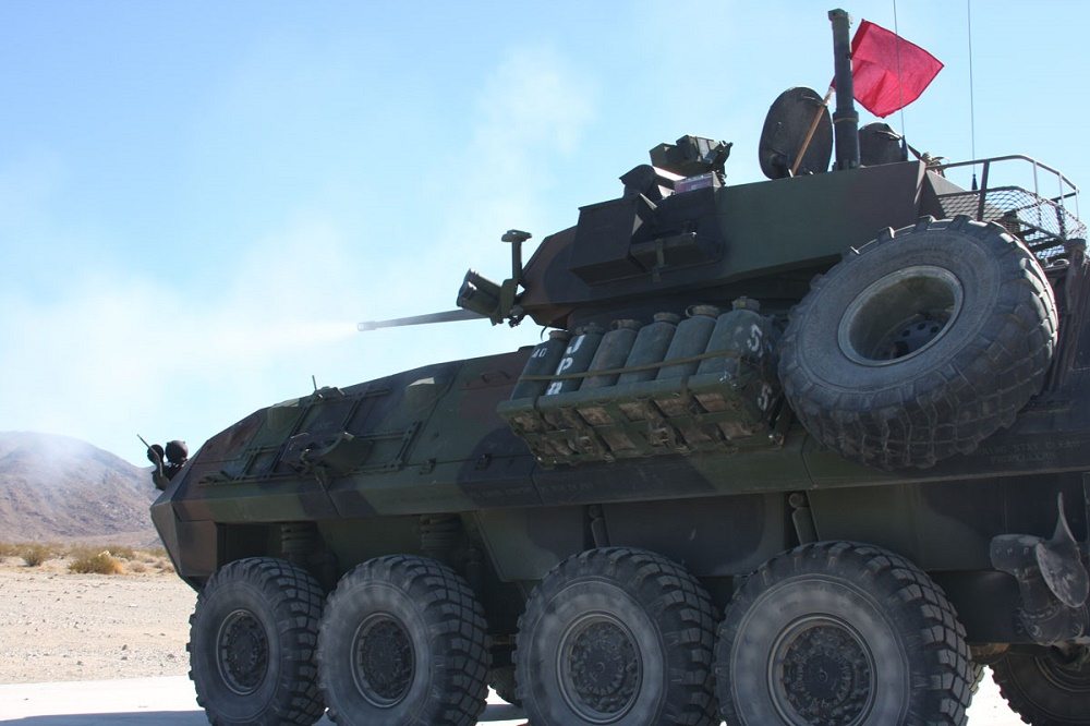 Soldiers fire the gun on an LAV-25 Light Armored Vehicle.