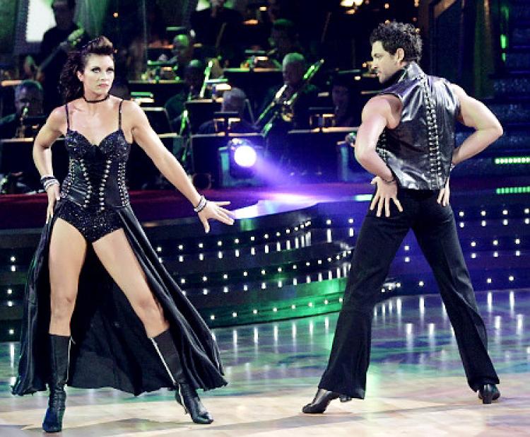 Misty May-Treanor and Maksim Chmerkovskiy strike a pose in matching black leather-studded costumes on 'Dancing With the Stars.'