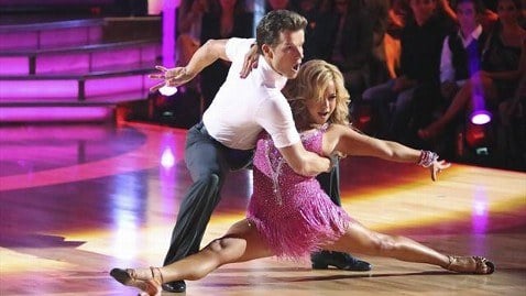 Sabrina Bryan does the splits while wearing a pink dress on 'Dancing With the Stars.'