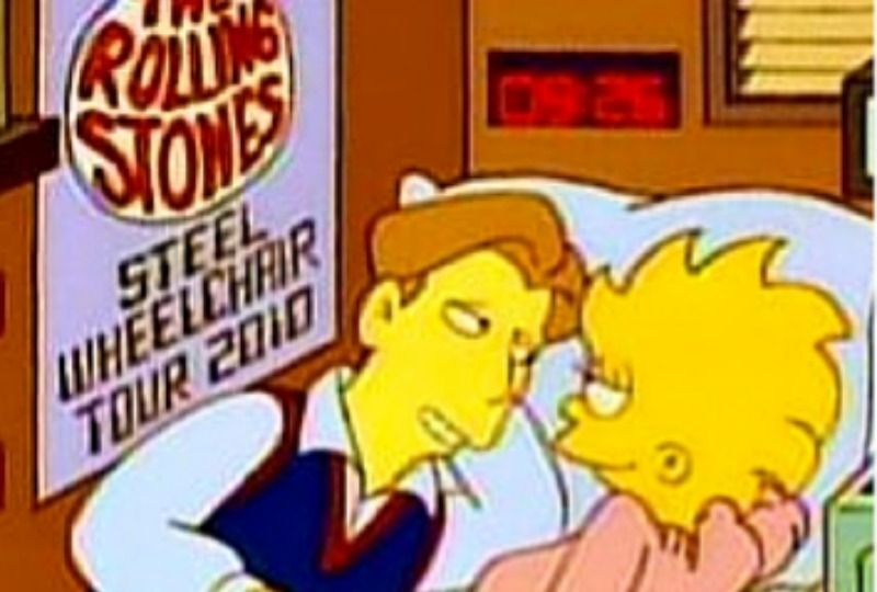 Lisa is lying on a bed and a boy. There is a Rolling Stones poster beside them.