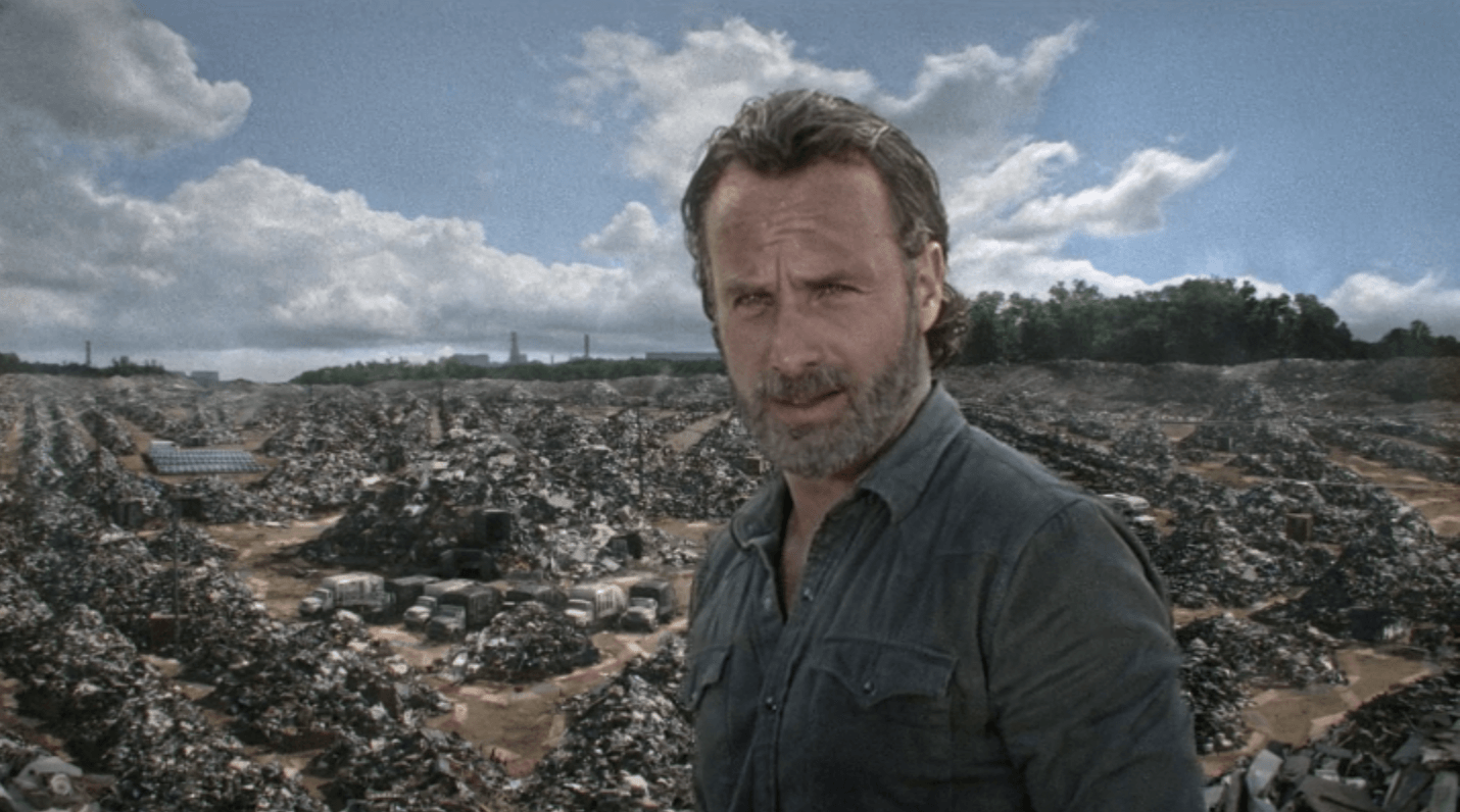 Rick stands in front of lot of trash in a scene from 'The Walking Dead's seventh season.