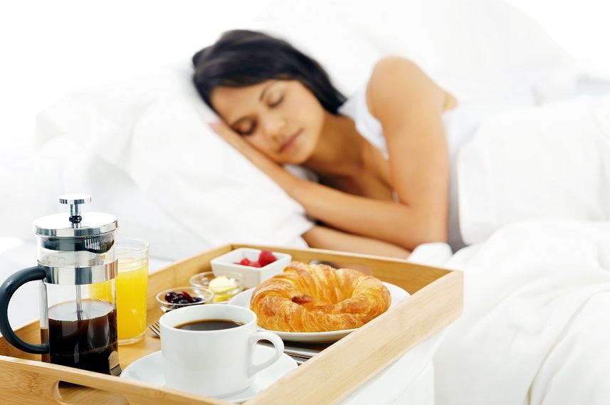 Sleeping woman with breakfast tray