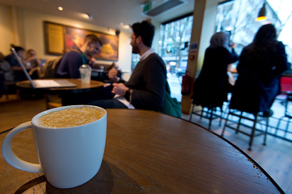 mug of coffee on a table in a starbucks