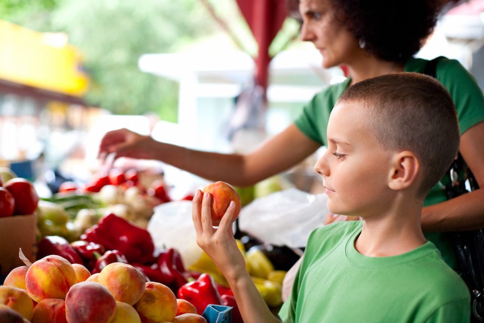 boy buying fruit