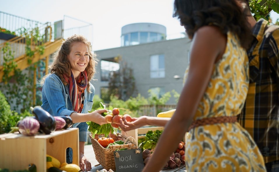 Female gardener selling organic crops