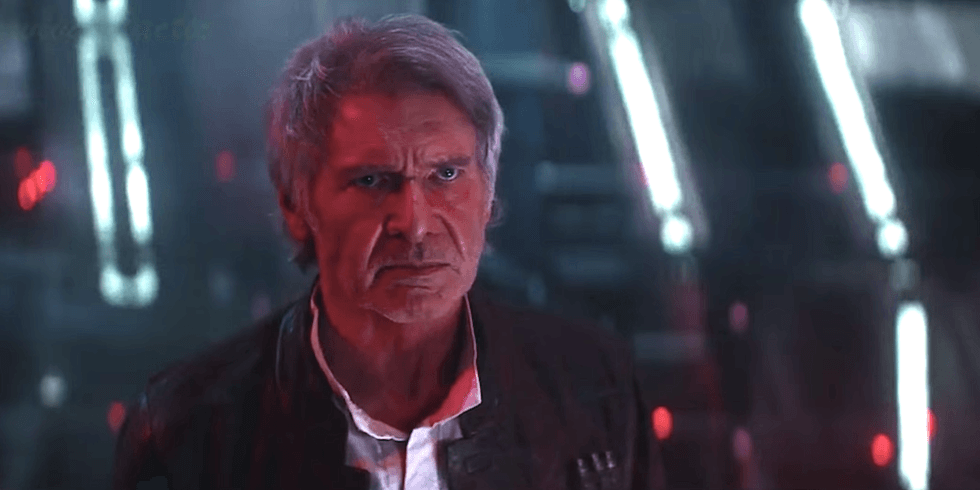 Han Solo cast in red light, looking defiantly on at his son offscreen