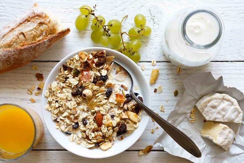 breakfast with muesli, grapes, cheese and juice
