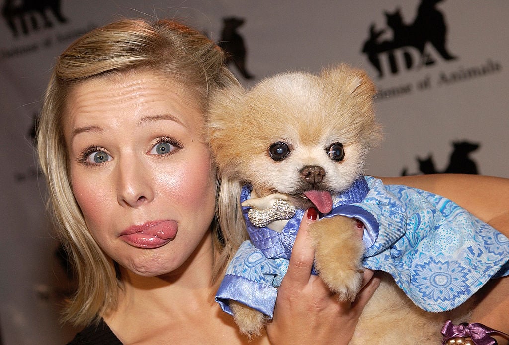 Kristen Bell poses with a dog.
