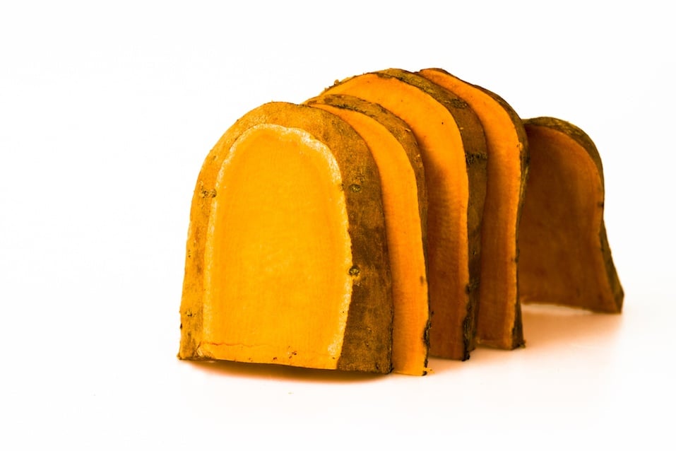 Slices of a large sweet potato arranged like toast in order to show possible low GI alternatives to high GI foods.