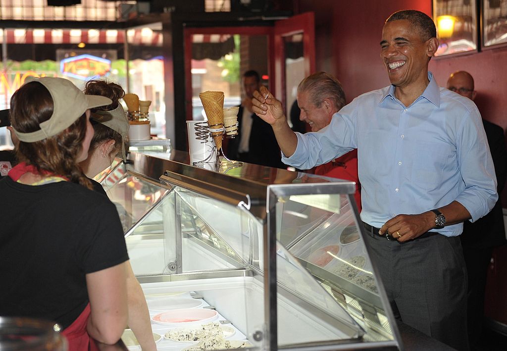 Obama talks to workers at an ice cream shop.