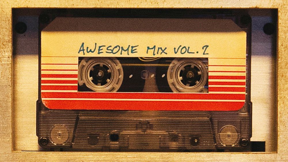 A cassette tape reading "Awesome Mix Vol. 2" on the label