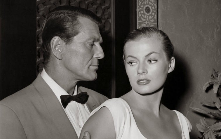 Black and white photo of Charles McGraw holds the arms of Anita Ekberg on 'Casablanca'