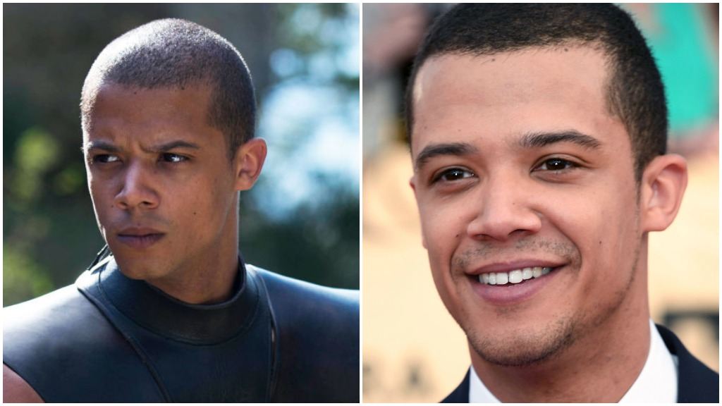A side-by-side comparison of Jacob Anderson as Grey Worm in Game of Thrones, and wearing a suit, smiling on the red carpet