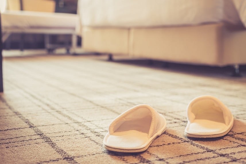 slippers on carpet in hotel room