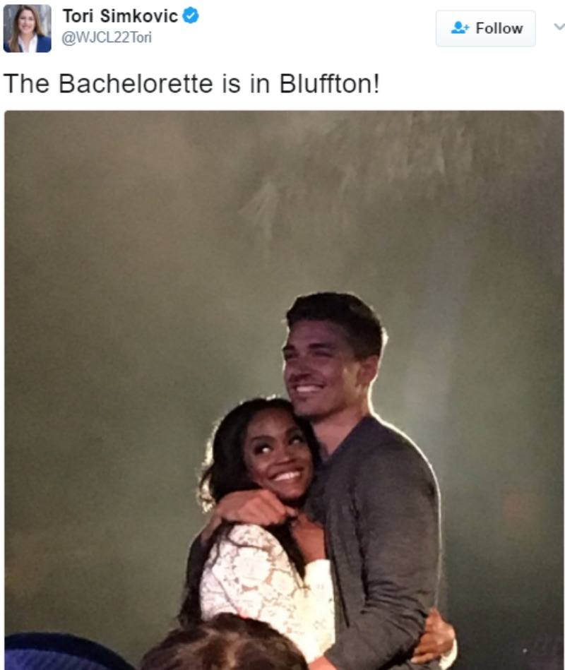 Dean Unglert is hugging Rachel Lindsay on stage.