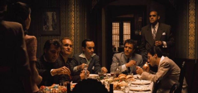 The cast of The Godfather is having dinner together.