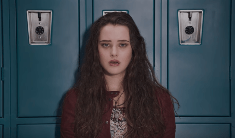 Hannah stands in front of a row of school lockers in 13 Reasons Why 