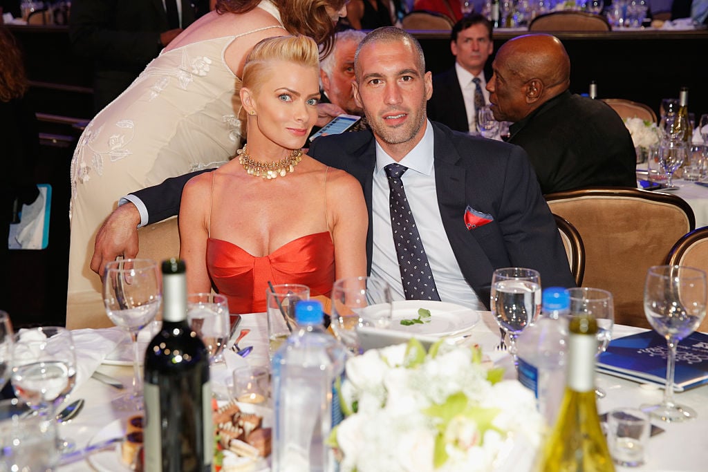 Jaime Pressly and Hamzi Hijazi , sitting at a dinner table and smiling together