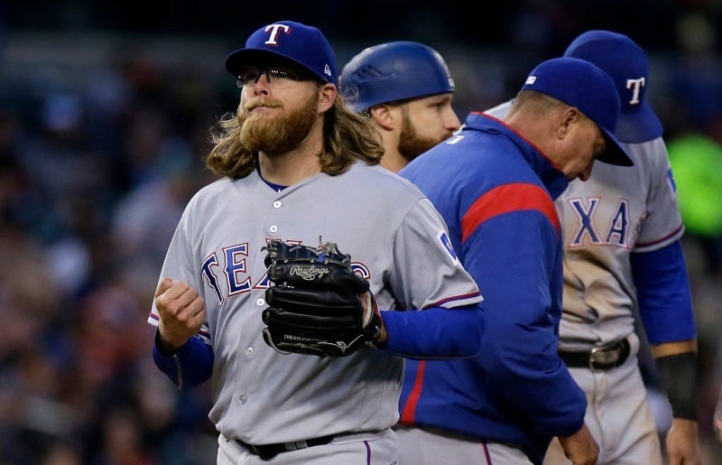 DETROIT, MI - MAY 20: A.J. Griffin #64 of the Texas Rangers heads for the dugout after being pulled by manager Jeff Banister #28 of the Texas Rangers during the fourth inning at Comerica Park on May 20, 2017 in Detroit, Michigan.